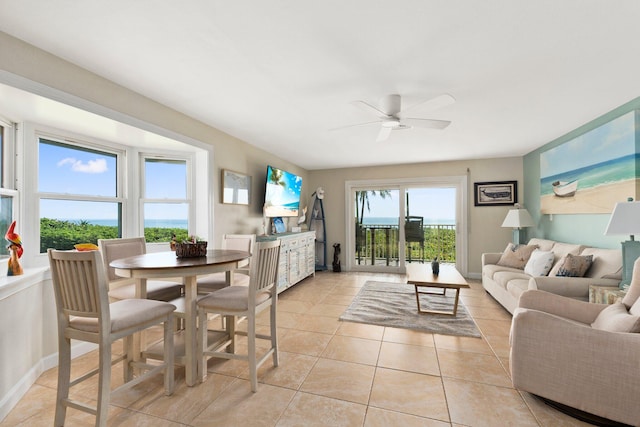 tiled living room featuring ceiling fan