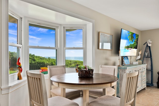 dining space with a healthy amount of sunlight and light tile patterned floors