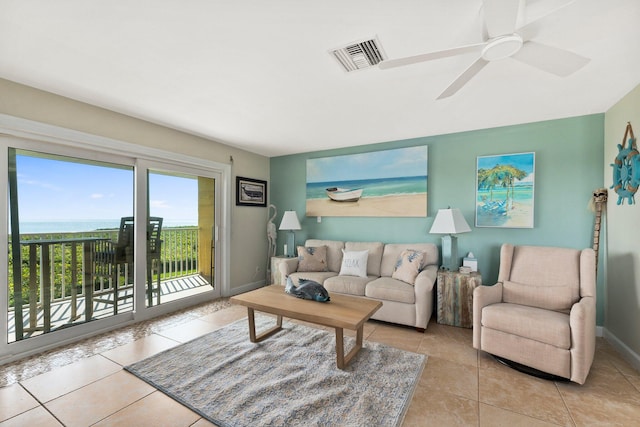 tiled living room featuring ceiling fan