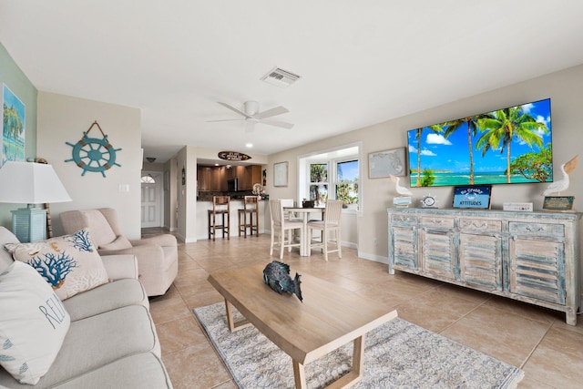 tiled living room with ceiling fan