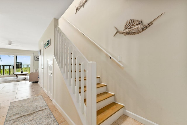 stairs with tile patterned floors