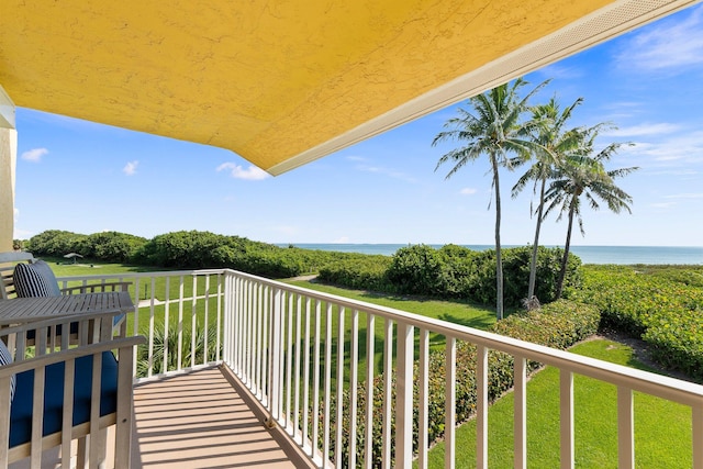 balcony featuring a water view