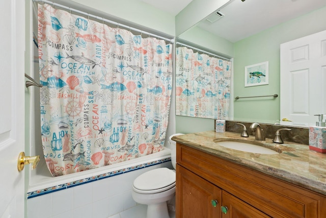 full bathroom featuring shower / bath combination with curtain, vanity, toilet, and tile patterned floors