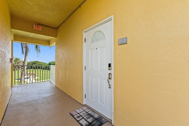 property entrance with a balcony