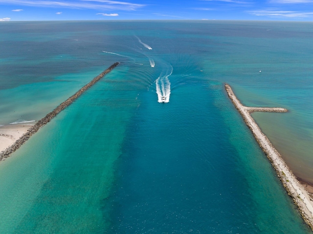 drone / aerial view with a view of the beach and a water view