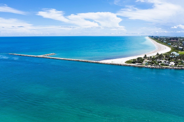 birds eye view of property featuring a view of the beach and a water view