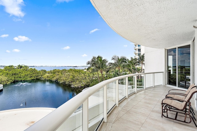 balcony featuring a water view