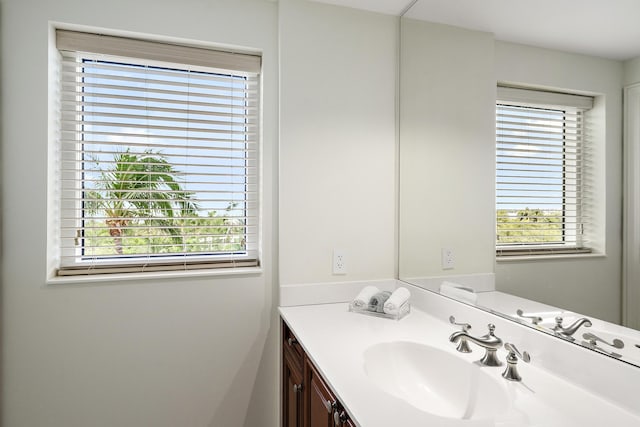 bathroom featuring plenty of natural light and vanity