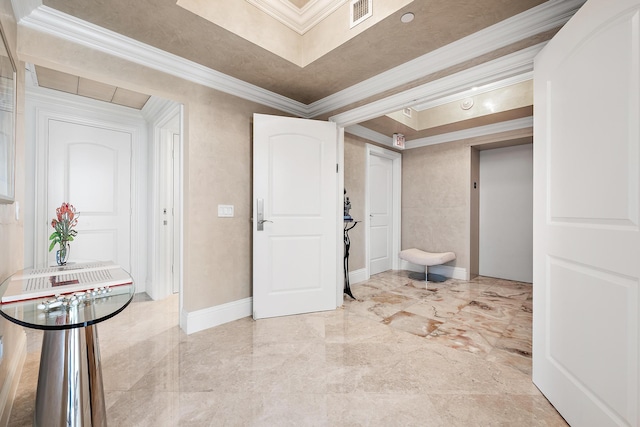 interior space featuring elevator, a tray ceiling, and crown molding