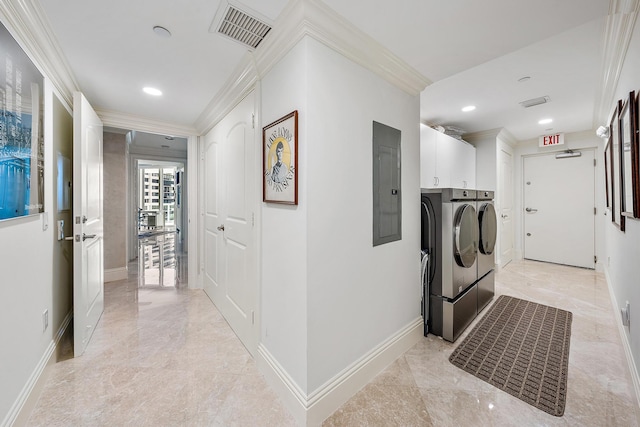 hall with washer and clothes dryer, crown molding, and electric panel