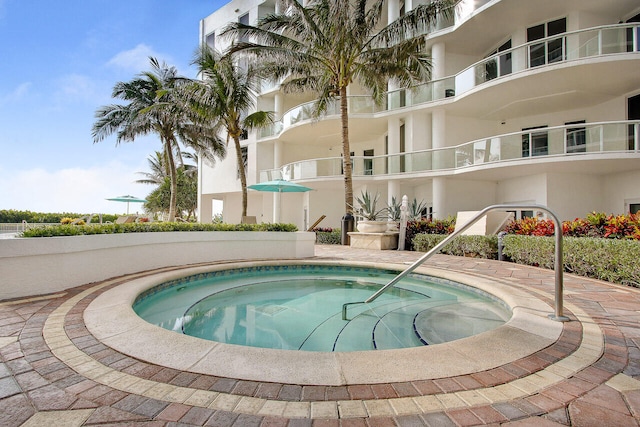 view of pool featuring a hot tub