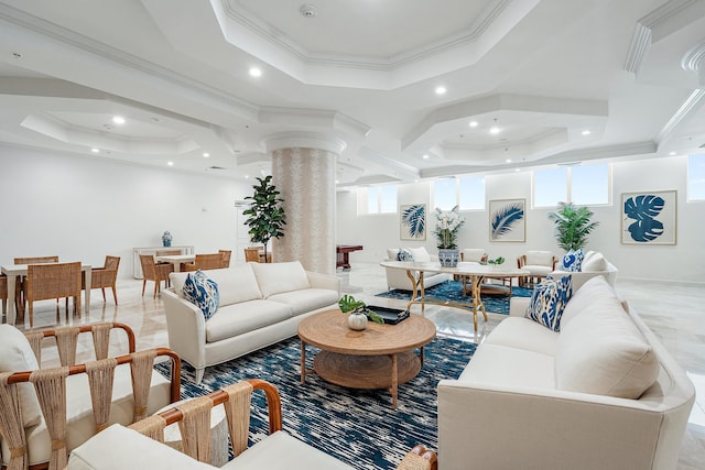 living room featuring a raised ceiling, ornamental molding, and ornate columns