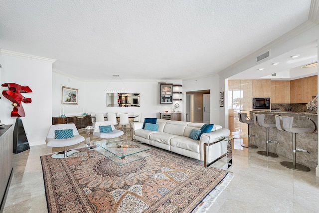 tiled living room featuring a textured ceiling and crown molding