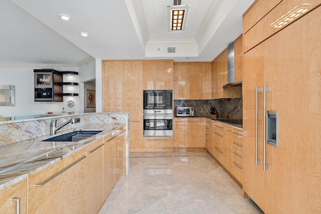 kitchen with paneled refrigerator, light stone counters, ornamental molding, stainless steel double oven, and sink