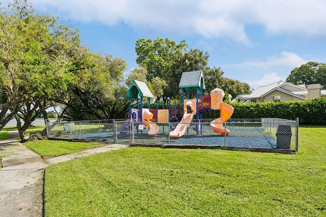 view of playground with a lawn