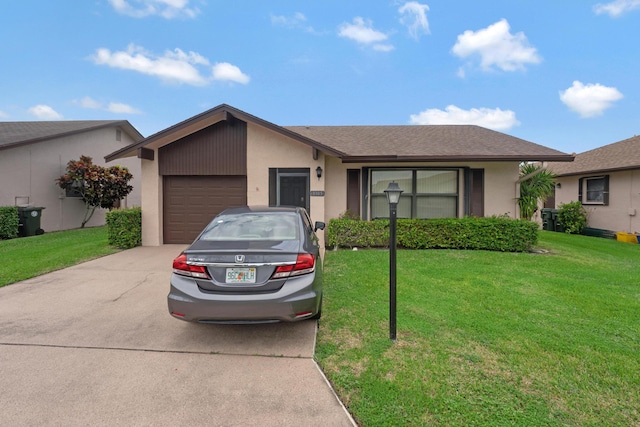 single story home featuring a garage and a front lawn