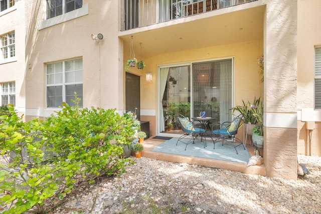 doorway to property featuring a patio area