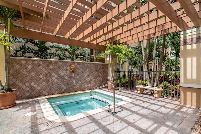 view of pool featuring a patio, a pergola, and an in ground hot tub