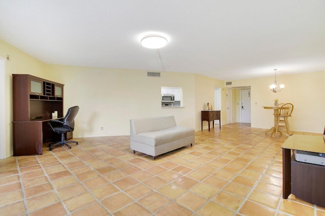 tiled living room featuring a chandelier