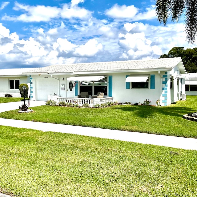 ranch-style home featuring a front yard, a garage, and central AC