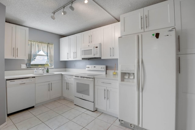 kitchen with a textured ceiling, sink, white cabinetry, white appliances, and light tile patterned floors