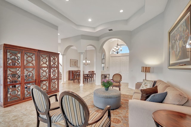 9772 Via Grandezza W, Wellington, FL 33411 - interior space with recessed lighting, an inviting chandelier, arched walkways, light tile patterned flooring, and decorative columns