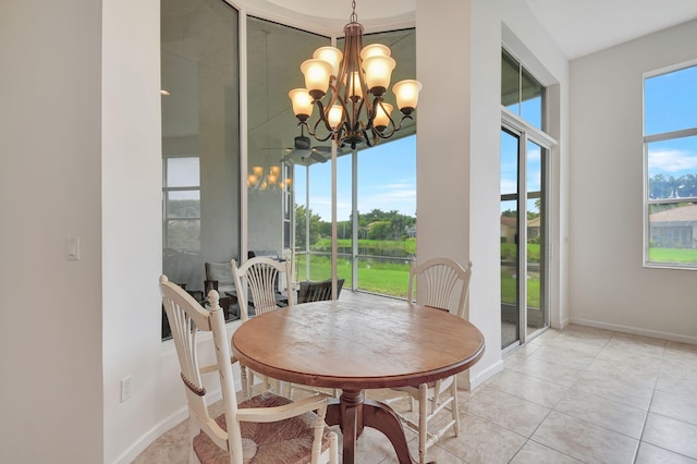 9772 Via Grandezza W, Wellington, FL 33411 - dining area with light tile patterned flooring, baseboards, and a notable chandelier