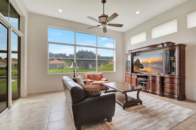 9772 Via Grandezza W, Wellington, FL 33411 - living area with recessed lighting, a wealth of natural light, a ceiling fan, and light tile patterned floors