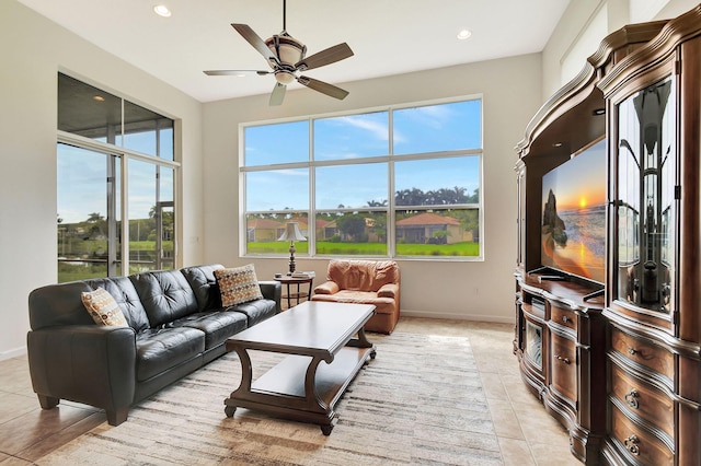 tiled living room featuring ceiling fan