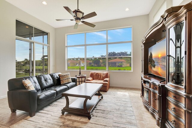 9772 Via Grandezza W, Wellington, FL 33411 - living area with light tile patterned floors, baseboards, a ceiling fan, and recessed lighting