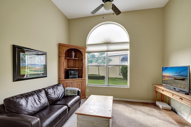 9772 Via Grandezza W, Wellington, FL 33411 - living area with light carpet, baseboards, and ceiling fan