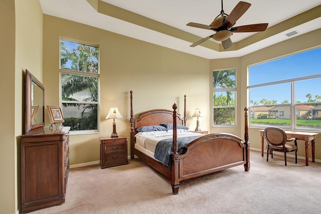 9772 Via Grandezza W, Wellington, FL 33411 - bedroom featuring light carpet, baseboards, and multiple windows