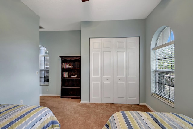 9772 Via Grandezza W, Wellington, FL 33411 - carpeted bedroom featuring baseboards, a ceiling fan, and a closet