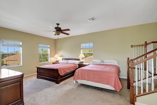 bedroom featuring ceiling fan and light colored carpet