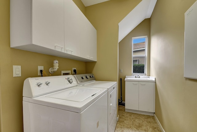 9772 Via Grandezza W, Wellington, FL 33411 - clothes washing area featuring washing machine and dryer, baseboards, cabinet space, and a sink