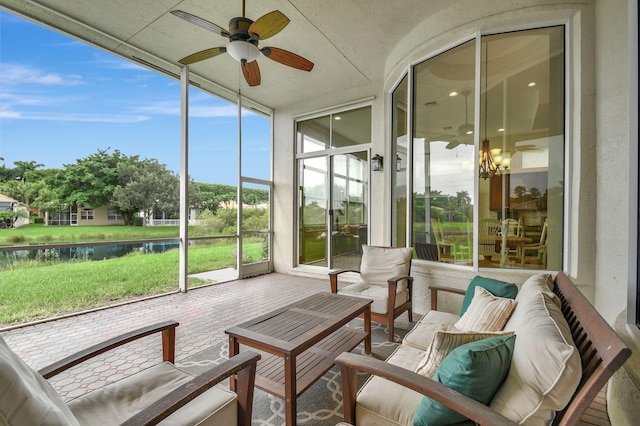 9772 Via Grandezza W, Wellington, FL 33411 - sunroom / solarium featuring ceiling fan, outdoor lounge area, and a water view
