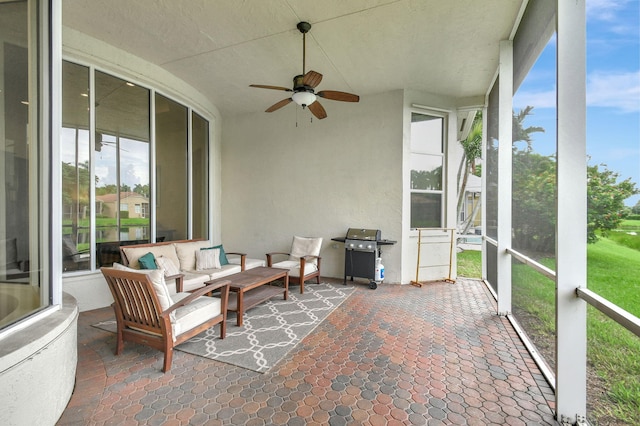 sunroom with ceiling fan