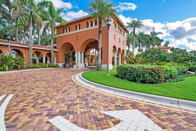 9772 Via Grandezza W, Wellington, FL 33411 - view of building exterior featuring curved driveway