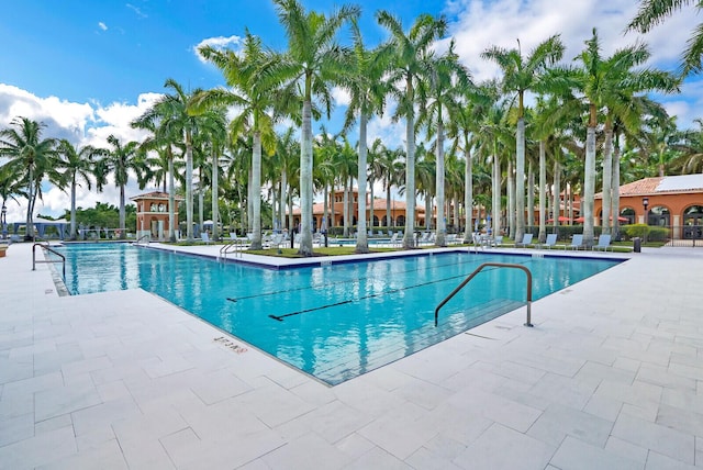 9772 Via Grandezza W, Wellington, FL 33411 - community pool featuring a patio area
