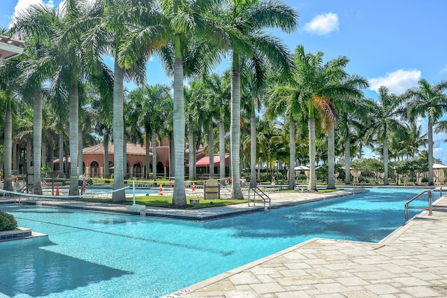 9772 Via Grandezza W, Wellington, FL 33411 - community pool with a patio area