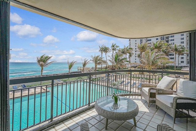 balcony featuring a water view