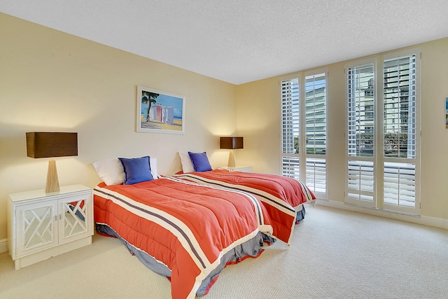 carpeted bedroom with a textured ceiling