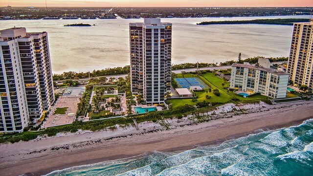 5380 N Ocean Dr Unit 2-I, Singer Island, FL 33404 - aerial view at dusk featuring a water view and a view of the beach