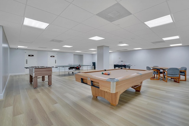 game room featuring a paneled ceiling, billiards, and light wood-type flooring