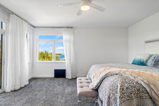 carpeted bedroom with ceiling fan