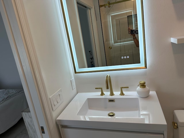 bathroom with vanity and toilet