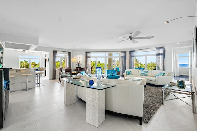 tiled living room with ceiling fan