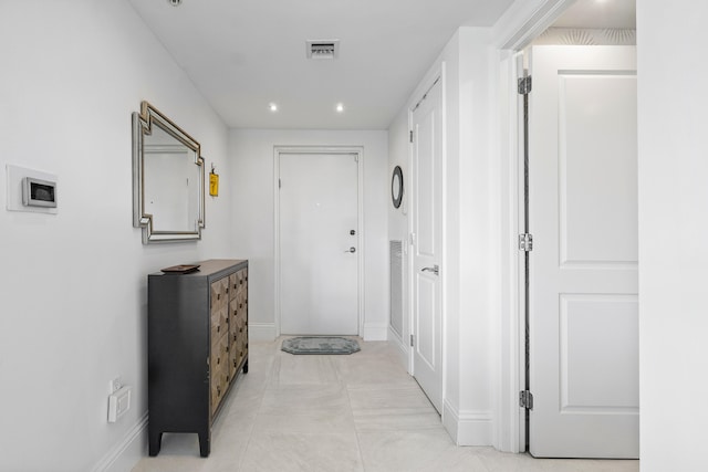 hallway featuring light tile patterned flooring