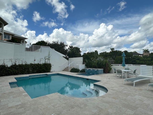 view of swimming pool featuring a patio