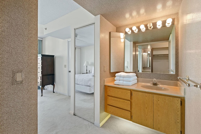 bathroom featuring vanity and a textured ceiling